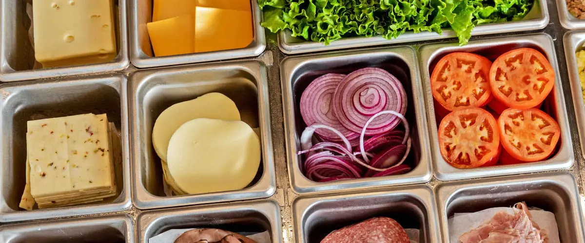 Overhead shot of deli sandwich ingredients and toppings